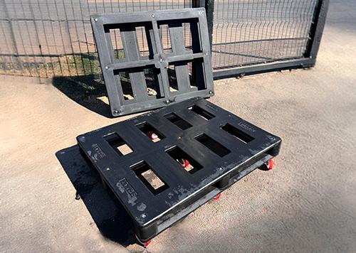 Heavy-duty recycled tyre pallet base with wheels for industrial use